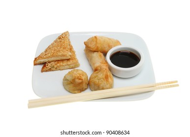 Chinese Snacks, Prawn Toast, Pancake Rolls, Wonton And A Ramekin Of Soy Sauce On A Plate With Chopsticks