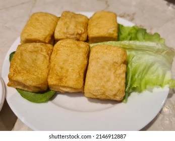 Chinese Steamboat Ingredients Fish Cake On White Plate With Chili Dipping Sauce. Selective Focus.