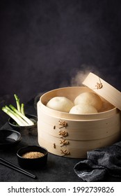 Chinese steamed buns baozi with bamboo steamer