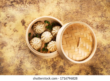 Chinese steamed dumplings in bamboo steamer, top view
