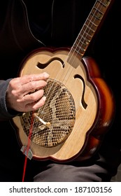 Chinese Street Musician Playing Ruan