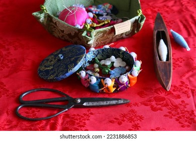Chinese tailor accessories in silk background