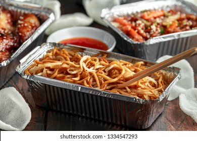 Chinese Takeaway Food. Egg Noodles With Bean Sprouts, Chilli Dip And Prawn Crackers