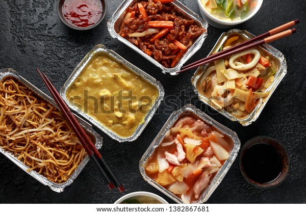 Chinese takeaway food. Pork Wonton dumpling soup,\
Crispy shredded beef, sweet and sour pineapple chicken, egg noodles\
with bean sprouts,\
curry.