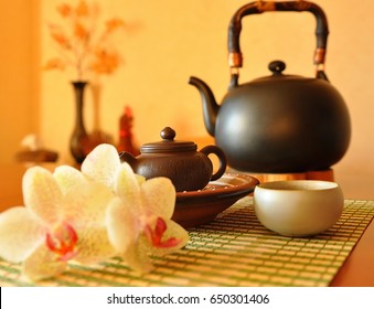 Chinese Tea Ceremony. Antique Oriental Tea Pot With Orchid Flowers On Wicker Tray. Traditional Asian Tea Set. Tea Party. Teatime. Beautiful Teapot. Chinese Kettle. Oriental Culture. Taiwan. Relaxation