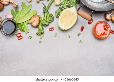 Chinese Or Thai Cuisine Vegetables And Spices Cooking Ingredients On Gray Stone Background, Top View, Border