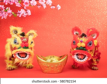 chinese traditional dancing lion with Gold ingot,Chinese calligraphy Translation:good bless for money