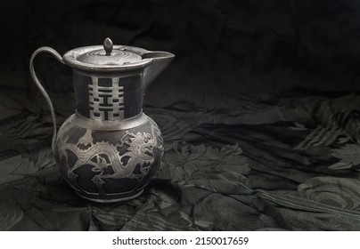 Chinese traditional teapot with dragon pattern - chinese characther double Translation meaning is Double Happiness. Antique metal teapot, Usually it use For Chinese tea ceremony during wedding day.  - Shutterstock ID 2150017659