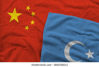 The Chinese and Uyghur flags pattern on towel fabric are placed together. It is the concept of the relationship between both. - Shutterstock ID 1842558211