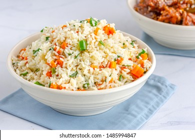 Chinese Vegetable Fried Rice in a Bowl with Side Dish  on White Background.