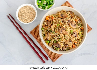 Chinese Vegetable And Mushroom Fried Rice With Sesame Seeds And Scallion Top Down Asian Food Photo