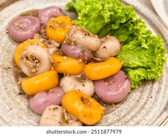 Chinese Vegetarian Food

Semi close up on a Chinese vegetarian food, the famous Hakka Abacus Beads or Seeds. Colorful glutinous ball, topped with fried garlics and fresh lettuce on the side. - Powered by Shutterstock