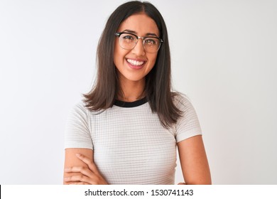 Chinese Woman Wearing Casual T-shirt And Glasses Standing Over Isolated White Background Happy Face Smiling With Crossed Arms Looking At The Camera. Positive Person.