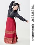 Chinese woman wearing Chinese Ming Dynasty Hanfu on black background
