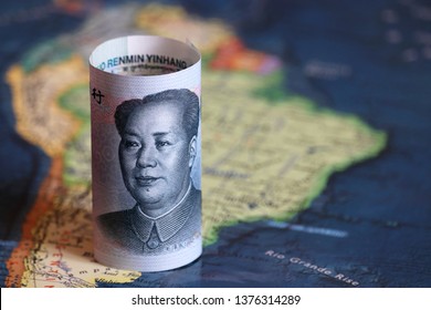 Chinese Yuan On The Map Of South America. Trading Between China And Latin American Countries, Economy And Investment