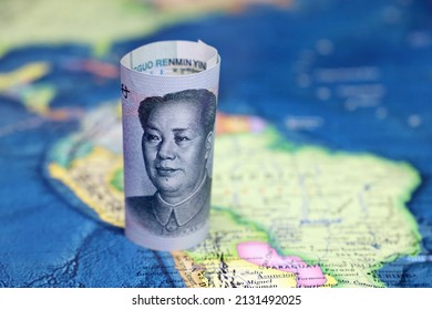 Chinese yuan on the map of South America. Trading between China and Latin American countries, economy and investment