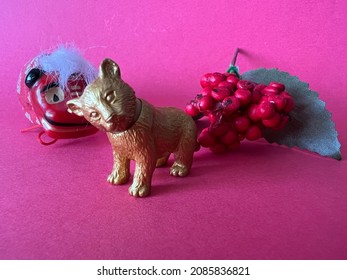 Chinese Zodiac Sign Year of Tiger, Happy Chinese New Year, Year of the Tiger. A miniature of a tiger and new year's ornaments on a red background.