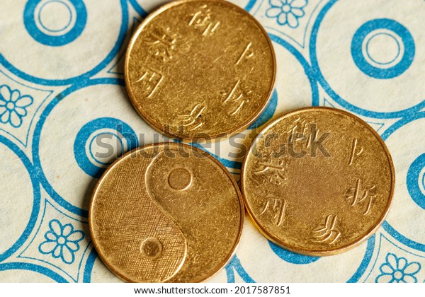I ching ancient Chinese oracle,
Book of Changes or Classic of Changes, with old
coins
