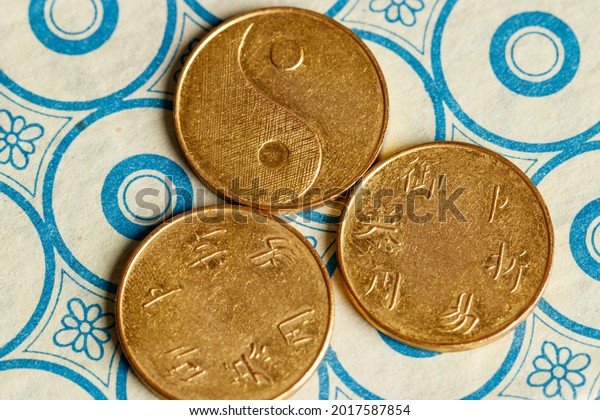I ching ancient Chinese oracle,\
Book of Changes or Classic of Changes, with old\
coins