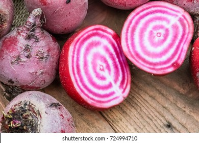 Chioggia striped or candy stripe beet whole and sliced in burlap sack on old rustic wooden table, selective focus - Powered by Shutterstock