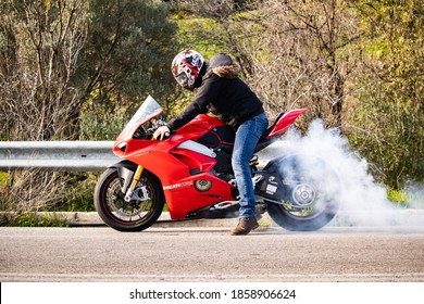 Chios, Greece - February, 2020. A man is doing burnout his motorcycle tire