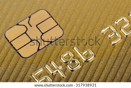 Chip of  gold plastic credit card.