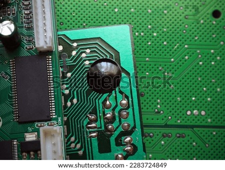 Chip on board electronic packaging (COB). Glob-top technology used in low-end devices. Circuit board manufacturing background.