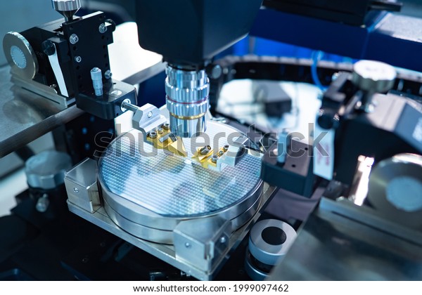 Chip testing\
equipment. Manufacturing of microchips. A close-up study of a test\
sample of a transistor chip under a microscope in the laboratory.\
Automation of production.