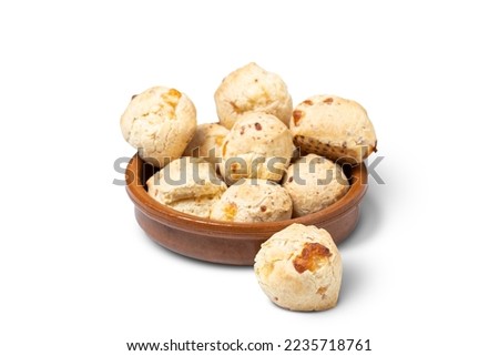 Chipa, typical Paraguayan cheese bread on bowl isolated on white background.