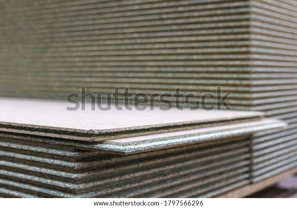 Chipboard sheets in the store. Timber is sold\
in a supermarket in a\
warehouse.