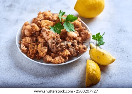Chipirones freied (fried fried squid), typical Spanish tapas