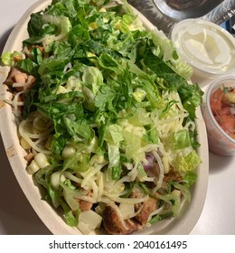 Chipotle Bowl Topped With Cheese And Lettuce!