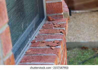 Chipped brick due to hailstorm, hail damage to the brick