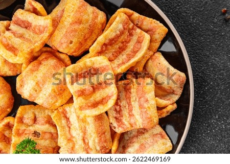 Chips bacon crispy rashers corn snacks fast food natural food fresh dish on the table rustic food top view copy space