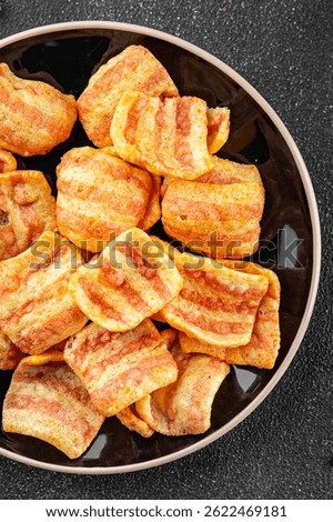 Chips bacon crispy rashers corn snacks fast food natural food fresh dish on the table rustic food top view copy space