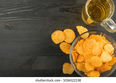 chips and beer, top view, with empty space under the inscription or advertisement