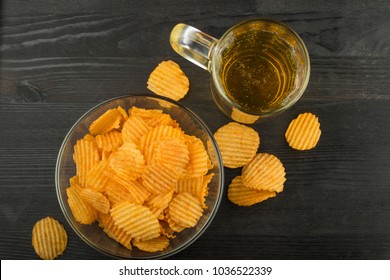 chips and beer, top view, with empty space under the inscription or advertisement