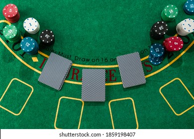 Chips Cards Lie On A Green Blackjack Table Top View. Casino Concept, Gambling