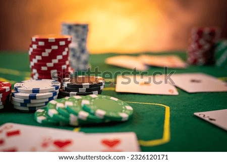 Chips are colored for poker and playing cards on the poker table before the game. poker. casino. win. isolated