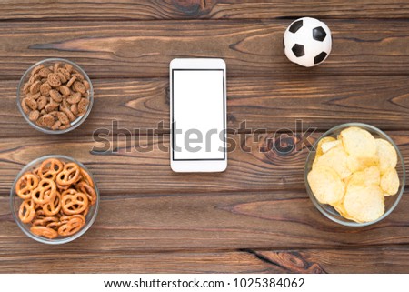 chips crackers snacks smartphone soccer ball stock photo edit now