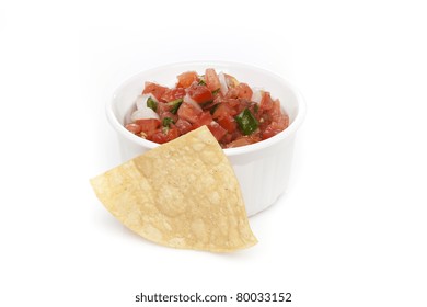 Chips And Fresh Salsa In A Bowl Against A White Background
