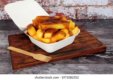 Chips And Gravy Meal In A Take Away Box With Lid