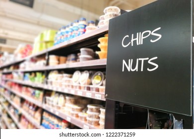 Chips And Nuts Signage Grocery Categoy Aisle At Supermarket