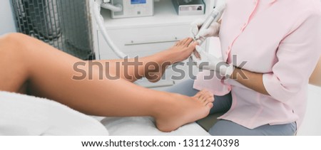 Chiropodist service . Chiropodist care about clients foot.