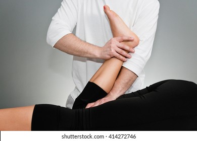 Chiropractic Adjustment - Chiropractor Working With Patient