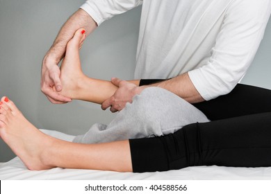 Chiropractic adjustment of patient's foot