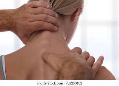 Chiropractic Back Adjustment. Osteopathy, Acupressure,Sport Injury Rehabilitation Concept. Female Patient Suffering From Back Pain And Physical Therapist