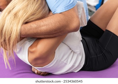 Chiropractic back pain treatment, with chiropractor performing an upper back adjustment on a patient lying on a therapy table, focusing on spinal alignment, pain relief, and improving mobility   - Powered by Shutterstock