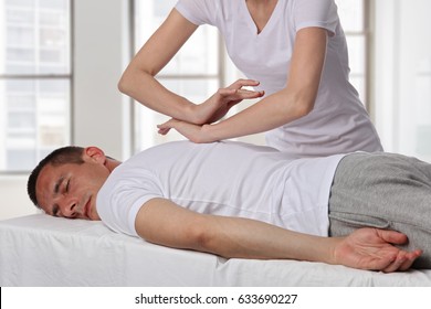 Chiropractic, Osteopathy, Manual Therapy, Acupressure. Therapist Doing Healing Treatment On Man's Back. Alternative Medicine, Pain Relief Concept. Rehabilitation After Back Injury, Physical Therapy.