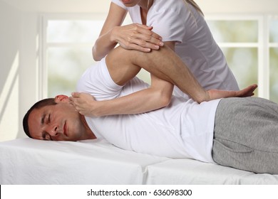 Chiropractic, Osteopathy, Manual Therapy, Acupressure. Therapist Doing Healing Treatment On Man's Back. Alternative Medicine, Pain Relief Concept. Rehabilitation After Back Injury, Physical Therapy.